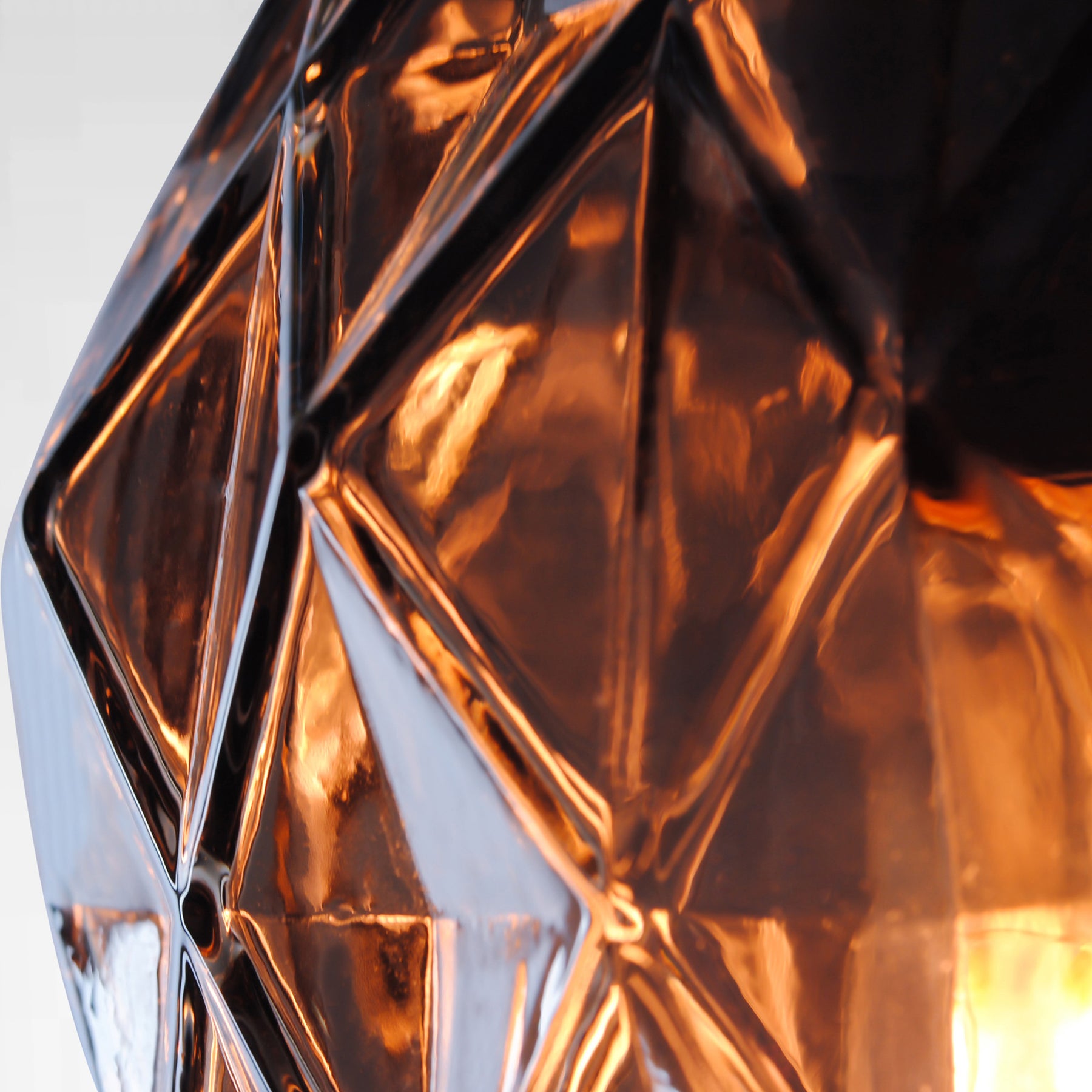 copper coloured cut glass pendant light detailing