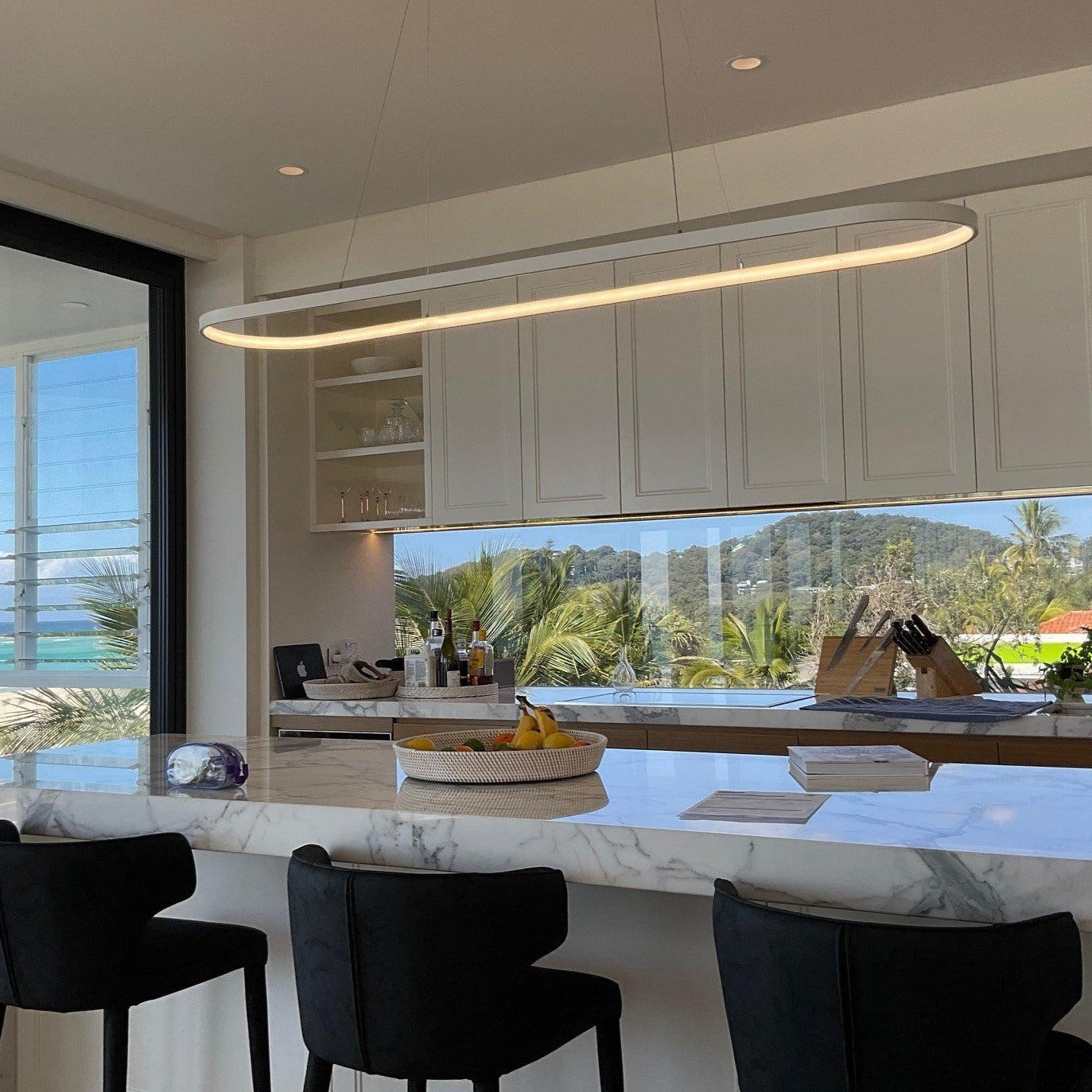 White Esperance LED Oval Lamp above Queensland beach side home kitchen