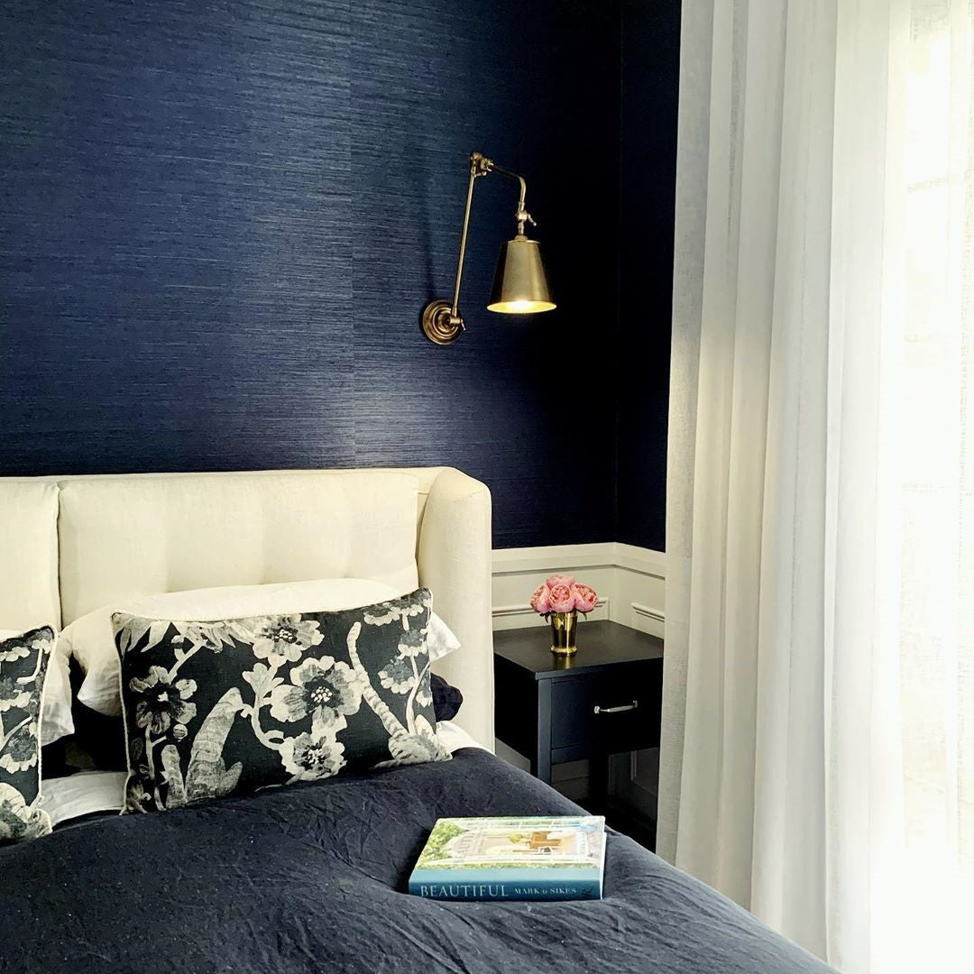 SMITH&SMITH Douglas Antique Brass Flexible Arm Sconce Wall Light in Bedroom with navy textured wall paper and cream bed head. insta