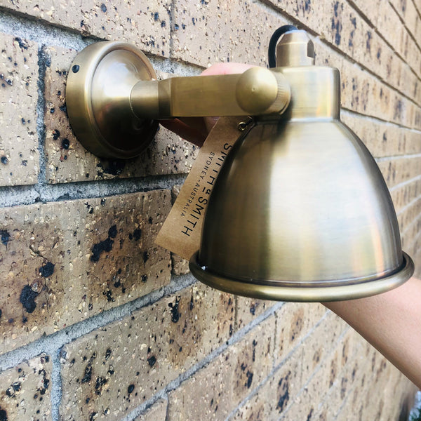 SMITH&SMITH Florence Indoor Wall Lamp in Antique Brass on brick wall