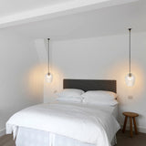 Sydney Apartment main bedroom with SMITH&SMITH Clear Glass Zarz Pendants hanging over each bedside table insta