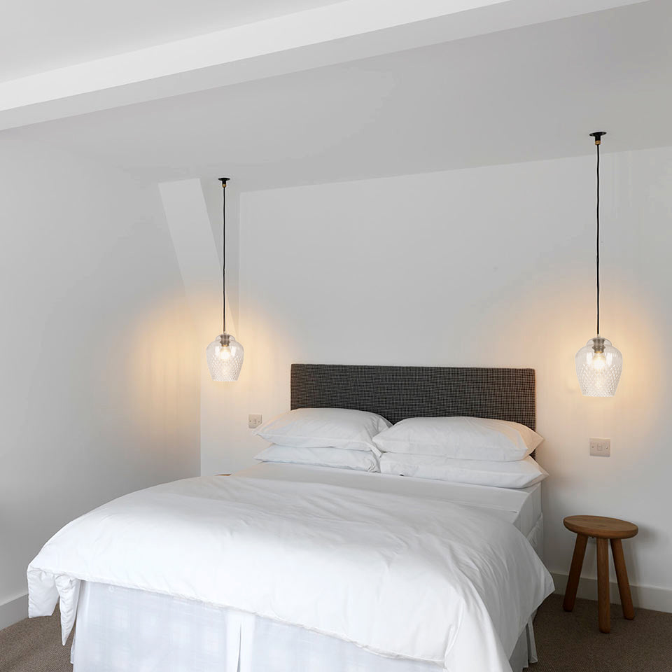 Sydney Apartment main bedroom with SMITH&SMITH Clear Glass Zarz Pendants hanging over each bedside table insta